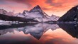 Panoramic view of the mountains reflected in the lake at sunset