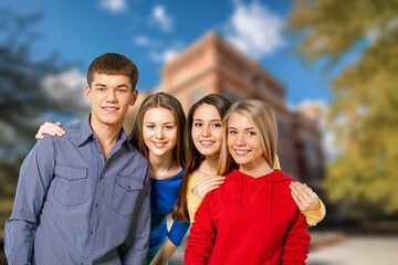 Wall Mural - Group of happy young students at campus together