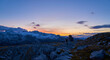 Beautiful panorama of the Dachstein Mountains with Sunset, People and Heilbronn Chapel.
