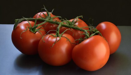 Wall Mural - a bunch of fresh juicy red ripe tomatoes on the vine isolated against a transparent background