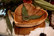 Wooden heart dish with ring and ferns lay flat details