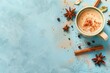 Warm and inviting cup of spiced coffee surrounded by star anise and cinnamon on a vibrant blue background, Concept of cozy beverages and autumnal warmth
