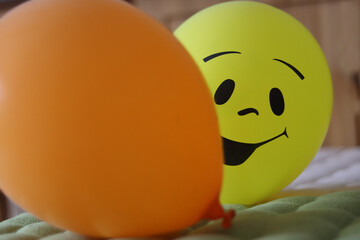 Yellow and orange balloons. Two balloons. Birthday celebration decorations