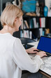 © Alina Hvostikova/Stocksy - Elegant businesswoman working on laptop at home