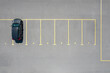 © Yaroslav Danylchenko/Stocksy - Aerial view of auto standing on parking place on number six