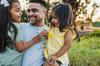 © Kelsey Smith/Stocksy - Adorable young family laughing