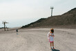 © Jimena Roquero/Stocksy - Kid on gravel path in Mount Etna volcano natural park