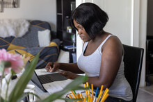 freelancer woman works on laptop computer, learn online from home
