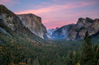 A beautiful pink afterglow in the sky at sunset at Yosemite. 