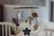 © Stereo Shot/Stocksy - Baby mobile hanging above crib