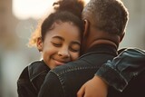 Fototapeta Londyn - african american teenage daughter hugging her father outside in town when spending time together