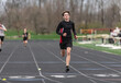 © Melanie DeFazio/Stocksy - Highschool boy running track