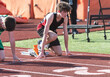 © Melanie DeFazio/Stocksy - Highschool boy running track