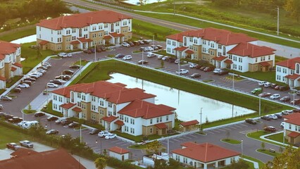Wall Mural - Aerial view of American apartment buildings in Florida residential area. New family condos as example of housing development in US suburbs