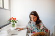 © ByLorena/Stocksy - Woman working at home office