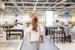 © Hernandez & Sorokina/Stocksy - Female Client Walking In Furniture Store