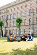 © Oleksii Syrotkin/Stocksy - Teamwork undergrad exam preparation learning academia yard cooperation