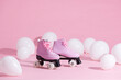 © Marc Tran/Stocksy - Pair of bright stylish roller skates on pink background