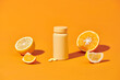 Vitamin C bottle mockup with fresh orange, natural bio supplement