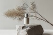 A white perfume bottle with space for text is positioned on a natural stone podium, next to an elegant dry twig. The scene emphasizes the naturalness of the product.