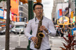© Luis Velasco/Stocksy - Talentend Man Playing The Saxophone On The Street.
