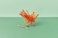 Shopping Cart With Pencils, One Broken Beside.