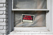 © Natalie JEFFCOTT/Stocksy - For rent sign in building window