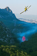 Firefighting airplanes extinguish a wildfire near a big city