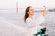 © Olga Moreira/Stocksy - Woman taking selfie on e-scooter