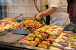 © Alvaro Lavin/Stocksy - Food on trays in restaurant.