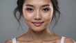Portrait of a beautiful asian woman on a light gray backgroun