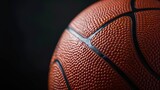 Fototapeta Sport - basketball close up on black background