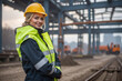 © Dwi - beautiful smilling Young female worker site engineer with a safety vest and hardhat