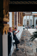 Male Tourists At The Grand Palace In Bangkok