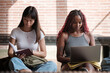 © Malquerida Studio/Stocksy - Diverse college friends studying at school