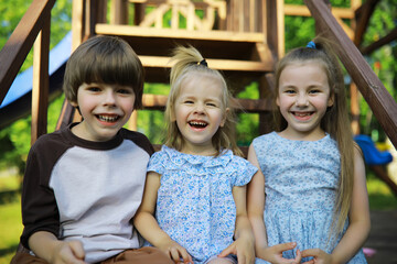 Wall Mural - Children walk in the summer in nature. Child on a sunny spring morning in the park. Traveling with children.