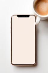 Wall Mural - Close-up, Minimalistic Top View of a smartphone with an empty white mock up screen with copy space on an office desk with a cup of coffee, Latte. Aesthetic Flat lay, Workspace, Modern technologies.