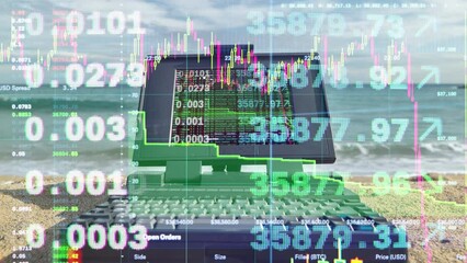 laptop computer by the sea with trading data on screen