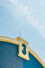 Exterior Of Modern Building Under Blue Sky With Number 3 Sign