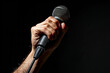 Dynamic Stage Presence Captured in Vocal Performance Microphone Banner