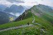 © Alina Miluseva/Stocksy - Man Hiking On Scenic Trail In Swiss Alps