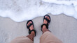 Feet in soft waves of the sea on the sandy beach, Gili Trawangan Lombok, Indonesia