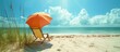 Beach chair and umbrella on sandy beach with sea and sky, bright sunny day with copyspace above and on the sand.