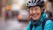 © VK Studio - Joyful senior woman cyclist enjoys a city ride, vibrant background.