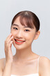 © Marc Tran/Stocksy - Cute young Asian woman is feeling happy with clean fresh skin