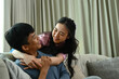 © Prathankarnpap - Loving young couple relaxing on couch at home, embracing on sofa and enjoying weekend time together