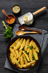 Wall Mural - greek lemon potatoes with garlic, cheese on dish