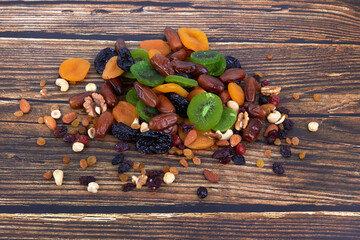 Wall Mural - Dry fruits on wood