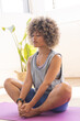 © Wavebreak Media - Young biracial woman practices yoga in a bright studio setting