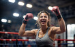 © Pham Ty - photo of excited boxing athlete female fists up and celebrating a victory on a blurred background